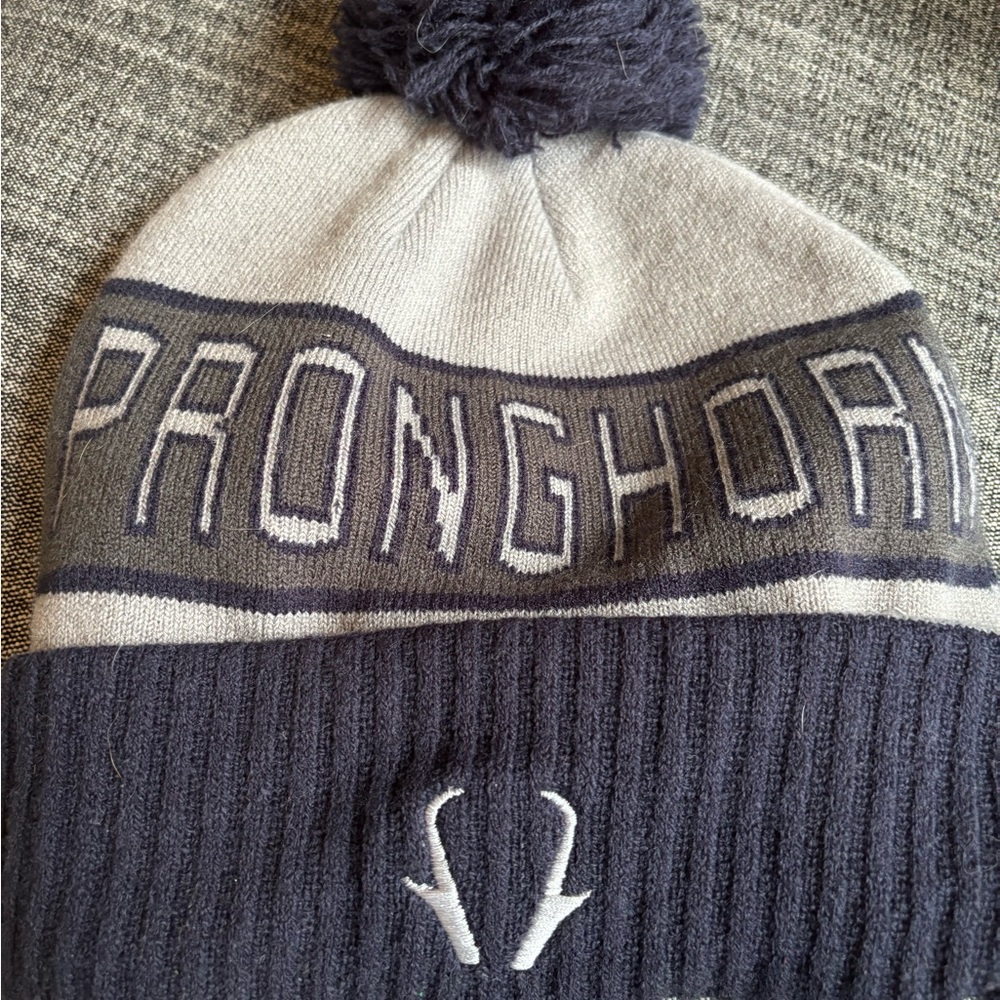 Gray and Navy Pom Beanie with Antler Logo